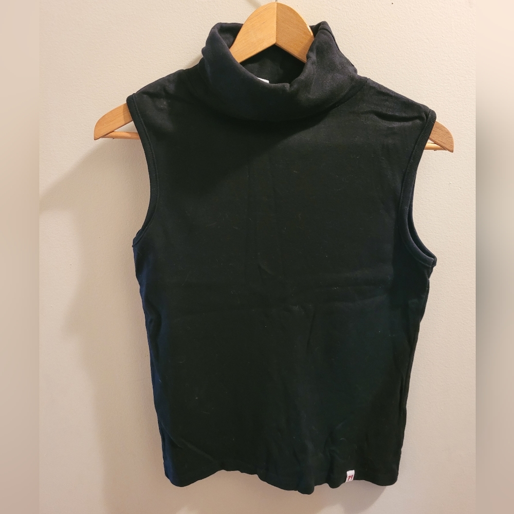 Sleeveless turtleneck sweater fir women by Identic in Europe. Size medium.